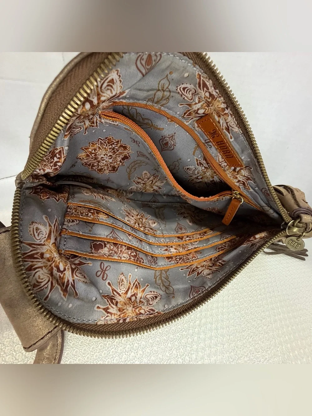 HOBO Metallic Bronze Studded Wristlet Tote with Tassel